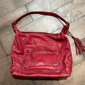 Red Danier all leather purse with multiple compartments. Excellent condition.